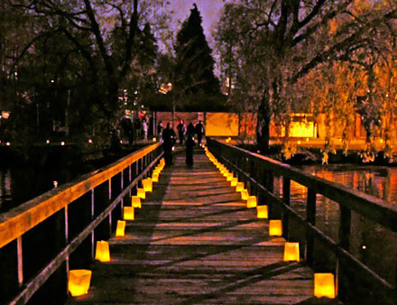 looking down the pier at night with luminarias